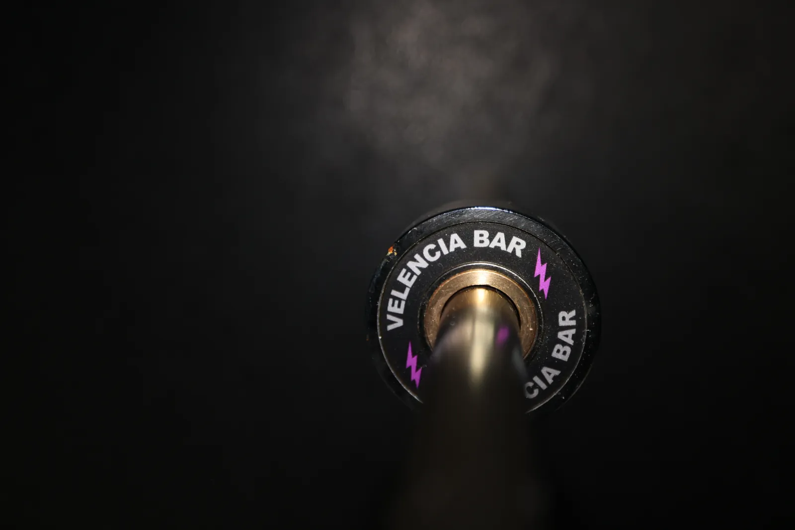 The Velencia Bar end cap alone on a dark gym floor.